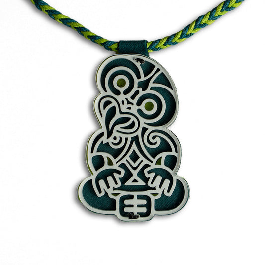 Necklace with a blue-green and white pendant on a white background
